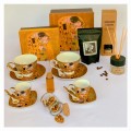 komplet złotych filiżanek z porcelana klimt  w pudełku, dyfuzor zapachowy, kawa ziarnista